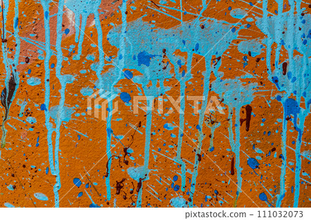 White plastered wall splattered with red paint. Paint splashes on the wall. Painted plaster wall. Abstract background. Painted plaster texture 111032073