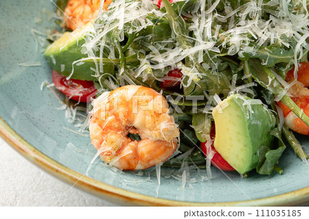 Portion of caesar salad with shrimp 111035185