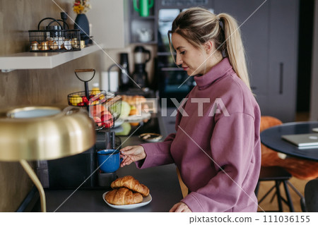 Female nurse, doctor getting ready for work, breakfast and coffee. Work-life balance for healthcare worker. 111036155