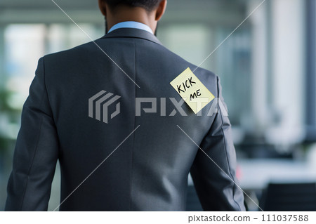 AI-generated content. April fools' day concept - kick me note on men's shoulder, office background 111037588