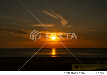 The moon and stars shining mysteriously in the night sky The moon and stars shining mysteriously in the night sky 111037761