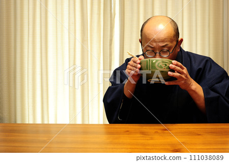 Middle-aged man relaxing at home Middle-aged man relaxing at home 111038089