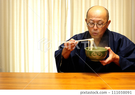 Middle-aged man relaxing at home Middle-aged man relaxing at home 111038091