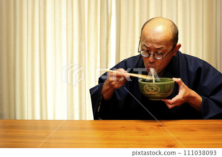 Middle-aged man relaxing at home Middle-aged man relaxing at home 111038093