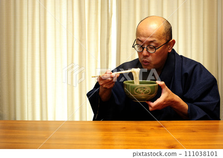 Middle-aged man relaxing at home Middle-aged man relaxing at home 111038101