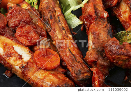 Stewed pork ribs in sauce, macro. 111039002