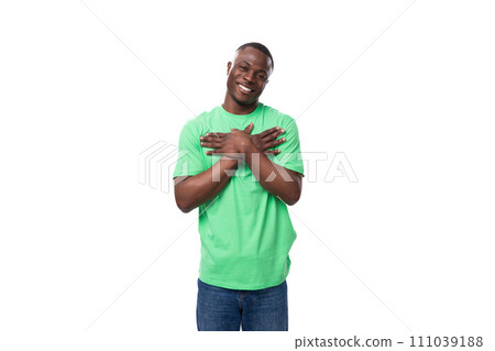 young friendly american man dressed in green t-shirt and jeans young friendly american man dressed in green t-shirt and jeans 111039188