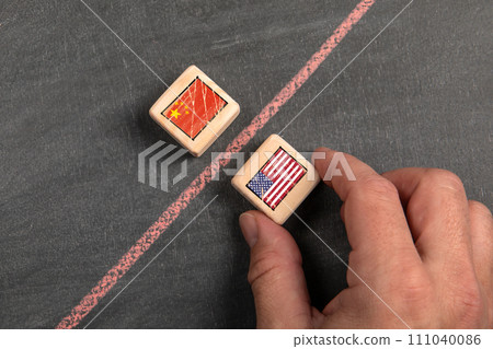 China and the United States Of America competition and import export. Wooden blocks on a dark China and the United States Of America competition and import export. Wooden blocks on a dark 111040086