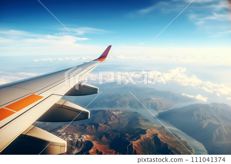 View from the airplane window, view of the airplane wing. View from the airplane window, view of the airplane wing. 111041374