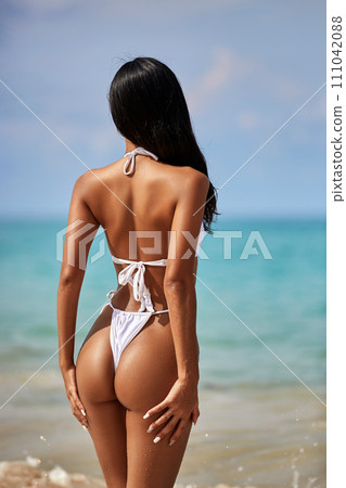 Beautiful asian girl in white bikini posing at... - Stock Photo [111042088]  - PIXTA