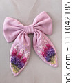 pink bow with embroidered delicate beautiful flowers in French knot technic 111042185