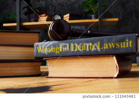 Pile of books and Wrongful death lawsuit. Pile of books and Wrongful death lawsuit. 111043461