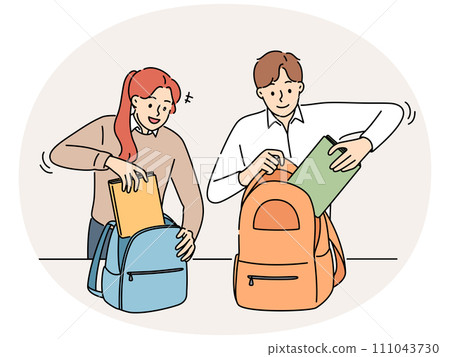 Smiling students pack backpacks in school 111043730