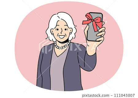 Smiling mature woman show smartphone as gift 111043807