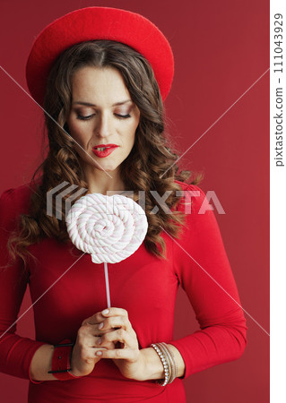 excited stylish woman isolated on red background excited stylish woman isolated on red background 111043929