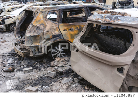 Kyiv, Ukraine - January 3, 2024: Burned civilians cars after a Russian's missiles attack 111043987