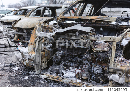 Kyiv, Ukraine - January 3, 2024: Burned civilians cars after a Russian's missiles attack 111043995