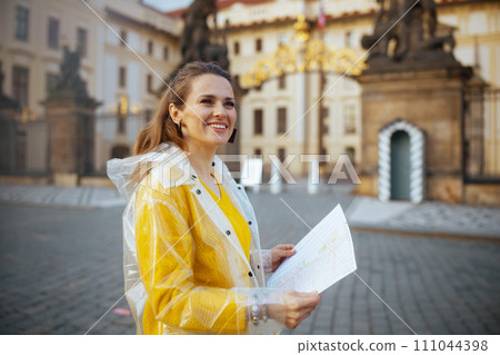 happy woman in blouse and raincoat in Prague Czech Republic happy woman in blouse and raincoat in Prague Czech Republic 111044398