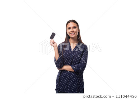 young cheerful cute caucasian brunette lady dressed in a dark blue blouse holding a credit card with 111044456