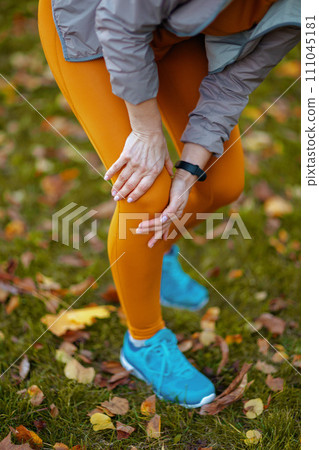 Closeup on woman in fitness clothes in park 111045181