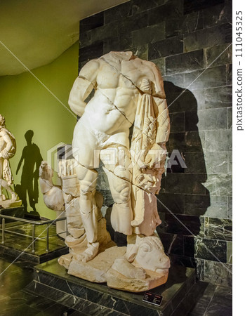 The statue of Hercules. Marble statues of gods and emperors of antiquity in the Museum of Antiquities of Antalya, Turkey. The statue of Hercules. Marble statues of gods and emperors of antiquity in the Museum of Antiquities of Antalya, Turkey. 111045325