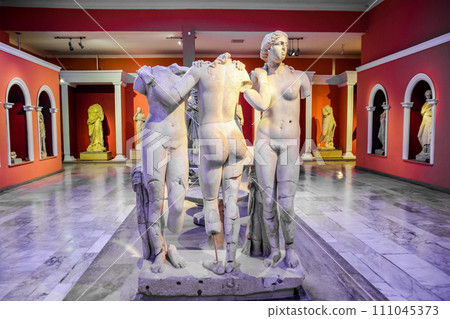 Marble statues of gods and emperors of antiquity in the Museum of Antiquities of Antalya, Turkey. 111045373