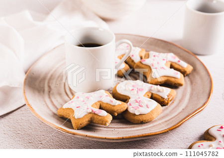 Sweet Mug-Hugging Cookies and cup of coffee on a plate Sweet Mug-Hugging Cookies and cup of coffee on a plate 111045782