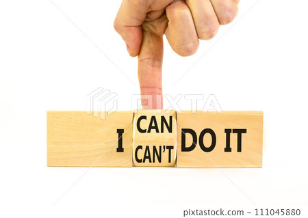 I can do it symbol. Concept word I can or can not do it on beautiful wooden cubes. Beautiful white table white background. Businessman hand. Business and i can or not do it concept. Copy space. 111045880