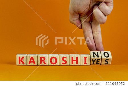 Karoshi yes or no symbol. Concept words Karoshi Yes or No on beautiful wooden blocks. Beautiful orange table orange background. Businessman hand. Business and stop karoshi concept. Copy space. Karoshi yes or no symbol. Concept words Karoshi Yes or No on beautiful wooden blocks. Beautiful orange table orange background. Businessman hand. Business and stop karoshi concept. Copy space. 111045952