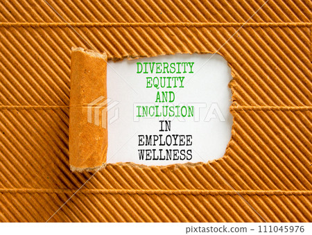 Diversity equity inclusion symbol. Concept words Diversity Equity and Inclusion in employee wellness on white paper on a beautiful brown background. Diversity equity inclusion concept. Copy space. Diversity equity inclusion symbol. Concept words Diversity Equity and Inclusion in employee wellness on white paper on a beautiful brown background. Diversity equity inclusion concept. Copy space. 111045976