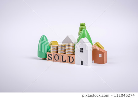 The inscription Sold made of wooden cubes on a plain background The inscription Sold made of wooden cubes on a plain background 111046274