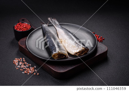 Pacific herring fillet marinated with salt, spices and herbs Pacific herring fillet marinated with salt, spices and herbs 111046359