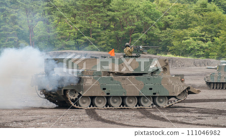 Japan Ground Self-Defense Force Type 90 tank recovery vehicle in motion Japan Ground Self-Defense Force Type 90 tank recovery vehicle in motion 111046982