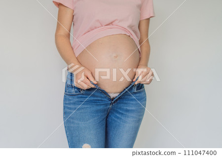 Struggling with jeans. Embrace comfort with maternity wear designed for your growing belly 111047400