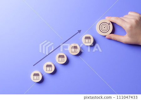 Business achievement goal and objective target concept. owner business startup profit earning, goal successful franchise store. Future forecasts for best product and store. hand putting round wooden. Business achievement goal and objective target concept. owner business startup profit earning, goal successful franchise store. Future forecasts for best product and store. hand putting round wooden. 111047433