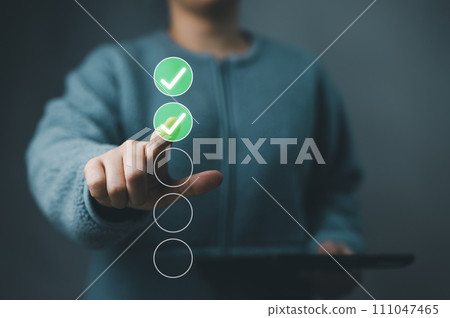 Woman tick correct sign mark in checkbox for quality document control checklist and business approve project concept. Online test, Checkmark, Filling out digital form checklist, online exam technology 111047465