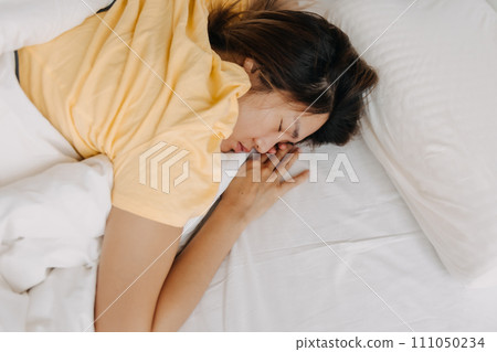 Asian woman sleeping deeply as she tired and sick. Asian woman sleeping deeply as she tired and sick. 111050234