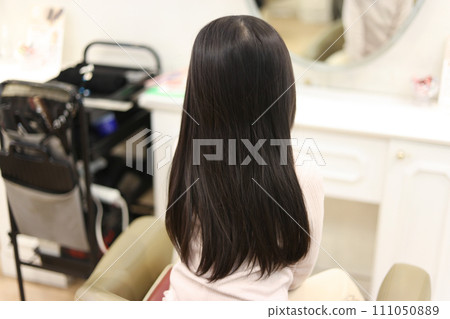 Girl's back view beauty salon image 111050889