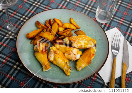 Crispy grilled chicken wings served with potato 111051555