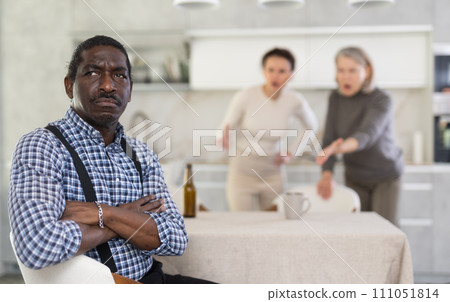 Adult woman and elderly woman quarreling with man Adult woman and elderly woman quarreling with man 111051814