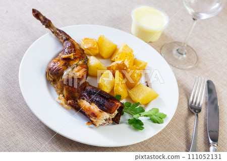 Grilled rabbit served in the plate 111052131