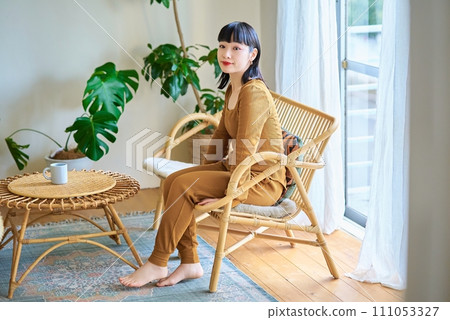 A young woman relaxing in the room 111053327