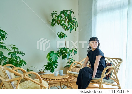 A young woman relaxing in the room 111053329