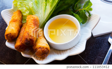 Nem rolls with lettuce and sauce Nem rolls with lettuce and sauce 111053412