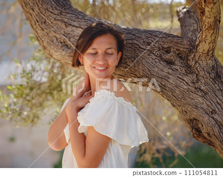 Beautiful Asian young woman in white dress outdoor Beautiful Asian young woman in white dress outdoor 111054811