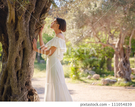 Beautiful Asian young woman in white dress outdoor 111054839