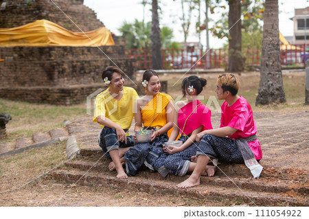Songkran Day, young Thai people wear Thai clothes and celebrate on Songkran Day. Songkran Day, young Thai people wear Thai clothes and celebrate on Songkran Day. 111054922