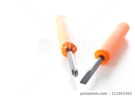 A photo of a Phillips screwdriver and a flathead screwdriver on a white background A photo of a Phillips screwdriver and a flathead screwdriver on a white background 111055363
