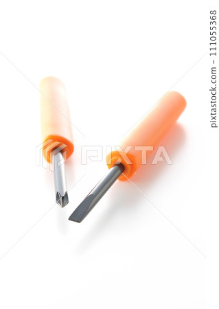 A photo of a Phillips screwdriver and a flathead screwdriver on a white background 111055368