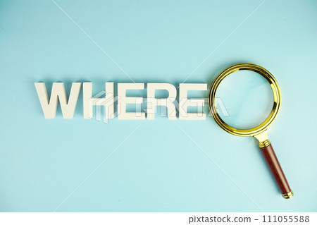 WHERE alphabet letters with magnifying glass on blue background 111055588